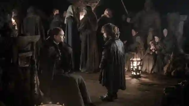 Sophie Turner and Peter Dinklage as "Sansa" and "Tyrion" in Game of Thrones.