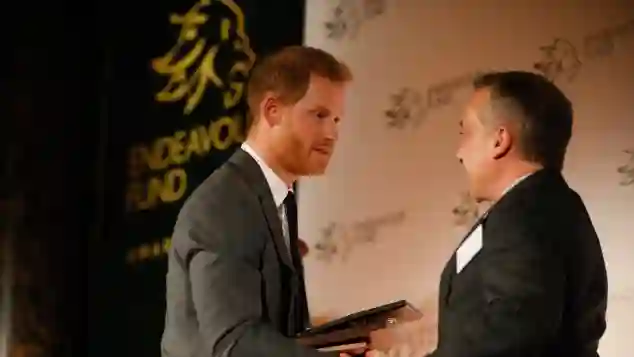 Prince Harry presents the The Henry Worsley Award to Shaun Pascoe, a former officer with the RAF Medical Emergency Response Team (MERT), at the Endeavour Fund awards