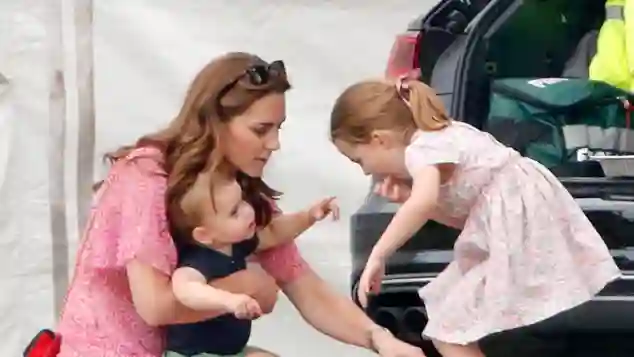 Duchess Catherine, Prince Louis and Princess Charlotte attending a polo match on July 10th, 2019
