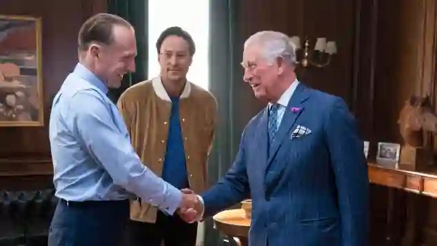 "M" meets His Royal Highness. Actor Ralph Fiennes and director Cary Joji Fukunaga greet Prince Charles.