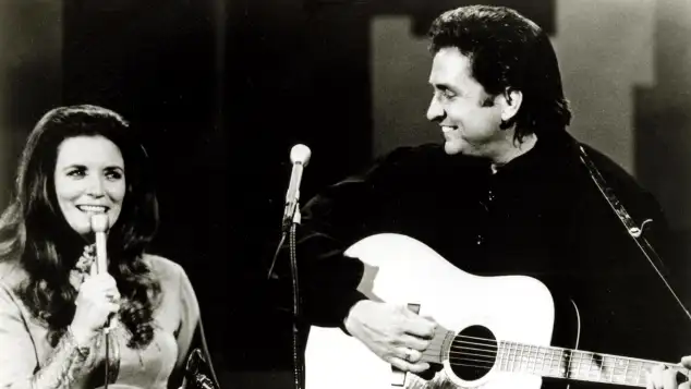 Johnny And June Carter Cash performing on stage
