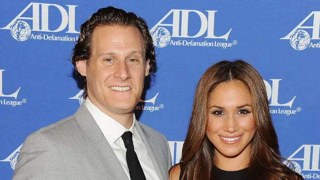 Trevor Engelson and Meghan Markle