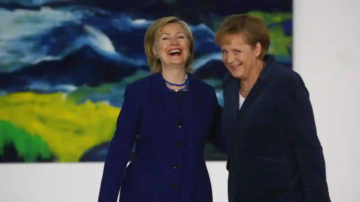 Hillary Clinton Takes Shot At Donald Trump In Tribute To Angela Merkel last day German chancellor Twitter post relationship message Olaf Scholz