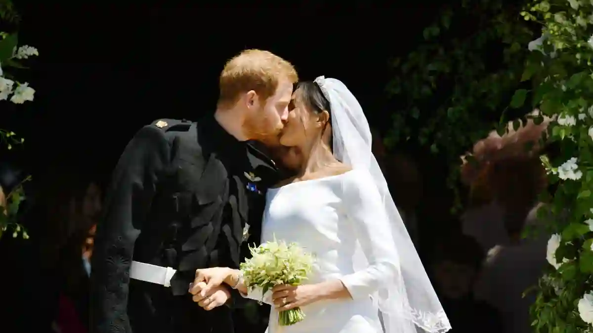 Prince Harry and Meghan Markle kiss on the steps of St George's Chapel in Windsor Castle after their wedding in St George's Chapel at Windsor Castle on May 19, 2018.