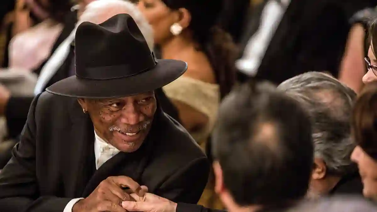 Actor Morgan Freeman greets another guest at the Kennedy Center Honors reception at the White House on December 2, 2012