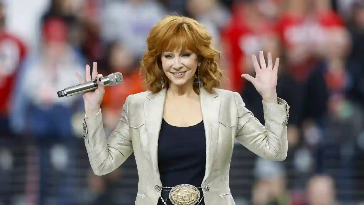 Country music icon and Grammy Award winner Reba McEntire sings the national anthem during the first quarter of Super Bow