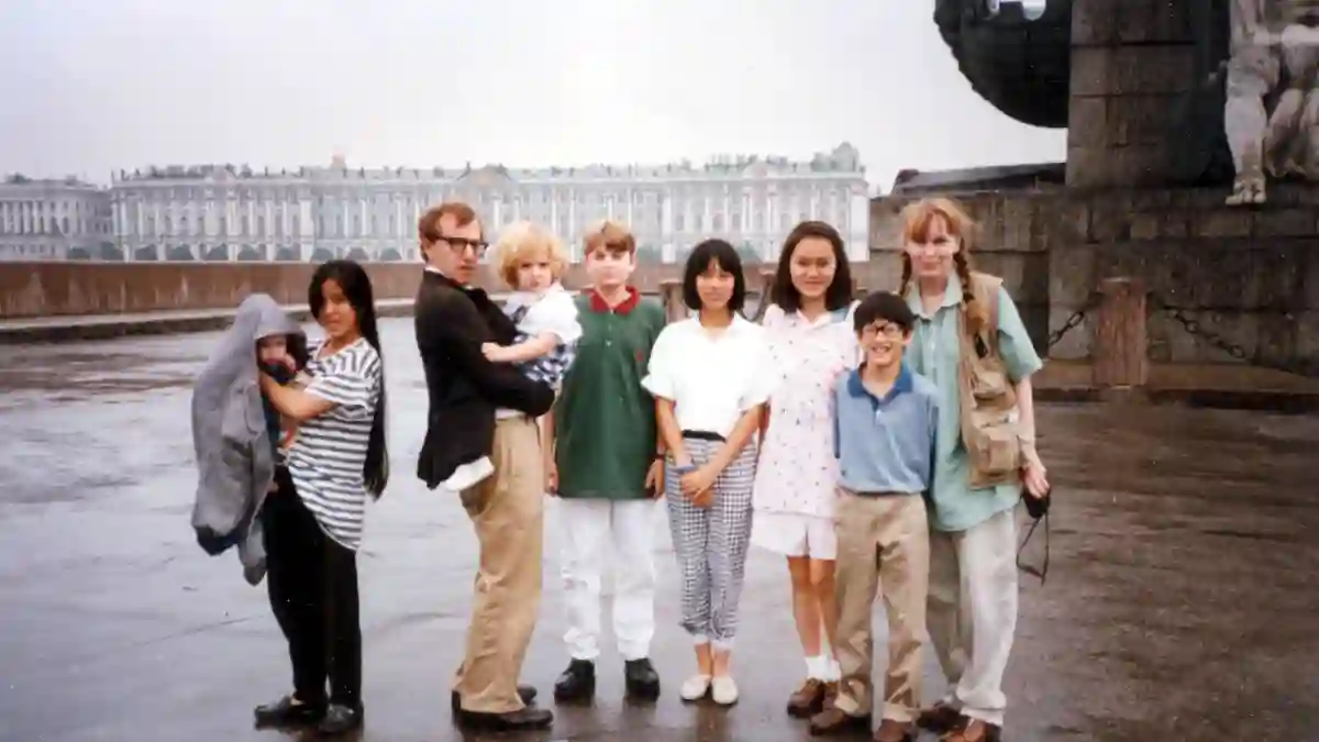 Mia Farrow and Woody Allen with their children (Satchel, Lark, Dylan, Fletcher, Daisy, Doon-Yi, and Moses in Leningrad.