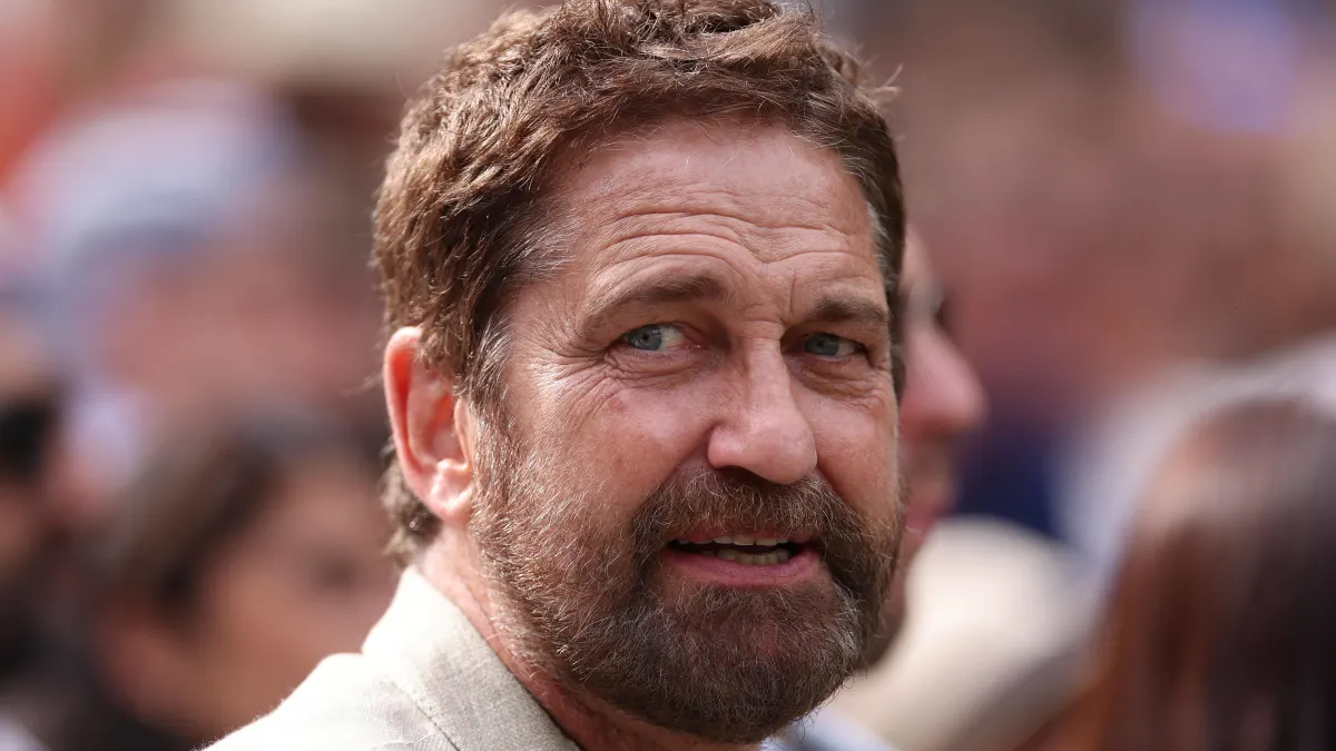 Actor Gerard Butler sits court side on Centre Court during the Mens Final at the 2024 Wimbledon Championships Wimbledon