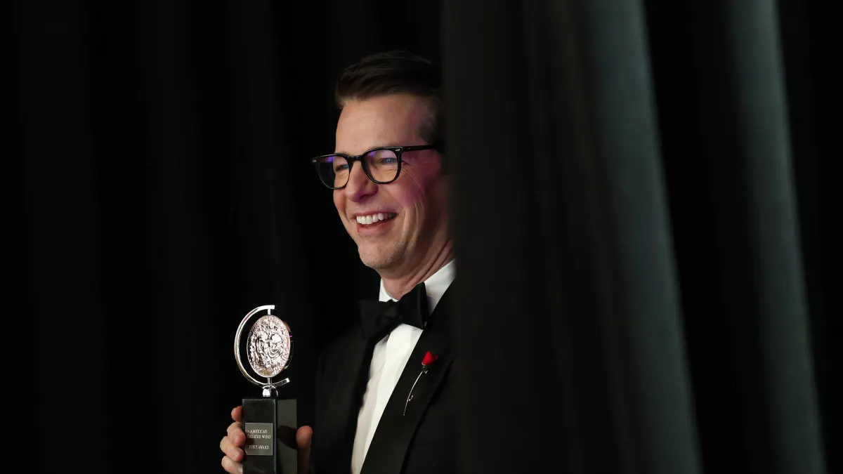Sean Hayes, winner of the award for Best Performance by a Leading Actor in a Play for Good Night, Oscar, holds a Tony Aw