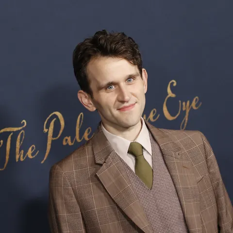 Harry Melling, who rose to fame as "Dudley Dursley" in "Harry Potter," on the red carpet in December 2022
