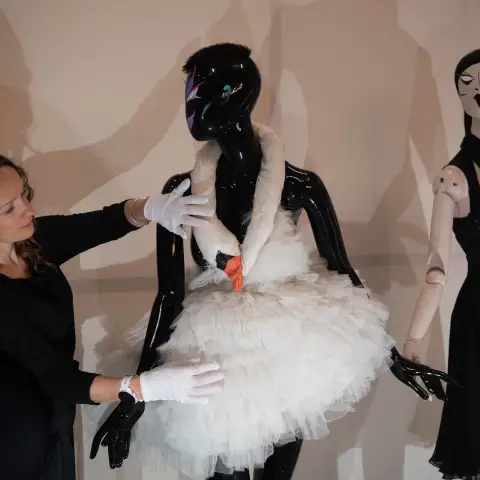Rebel: 30 Years Of London Fashion Sponsored by Alexander McQuee Press Preview - Design Museum, London A staff member adj
