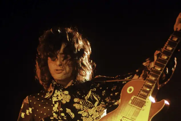 Jimmy Page of Led Zeppelin performing.