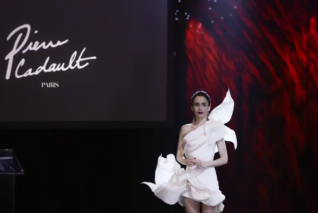 Lily Collins as 