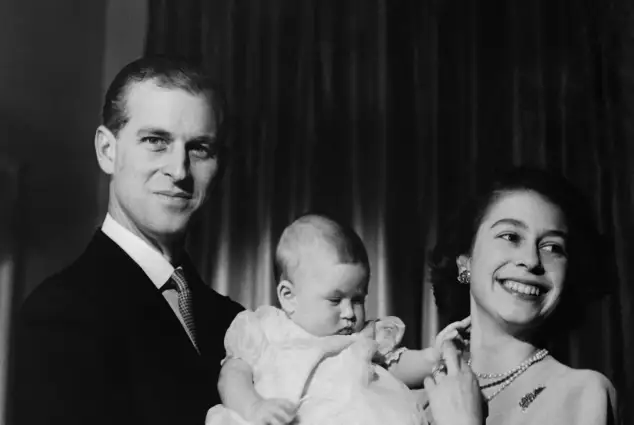 Undated picture showing the future Queen Elizabeth II of England and Prince Philip of Edinburgh posing with their son Prince Charles
