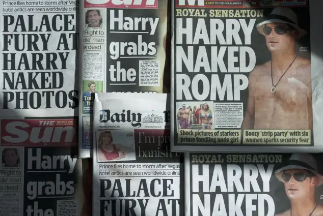 An arrangement of British daily newspapers photographed in London on August 23, 2012, shows the front-page headlines and stories regarding nude pictures of Britain's Prince Harry.