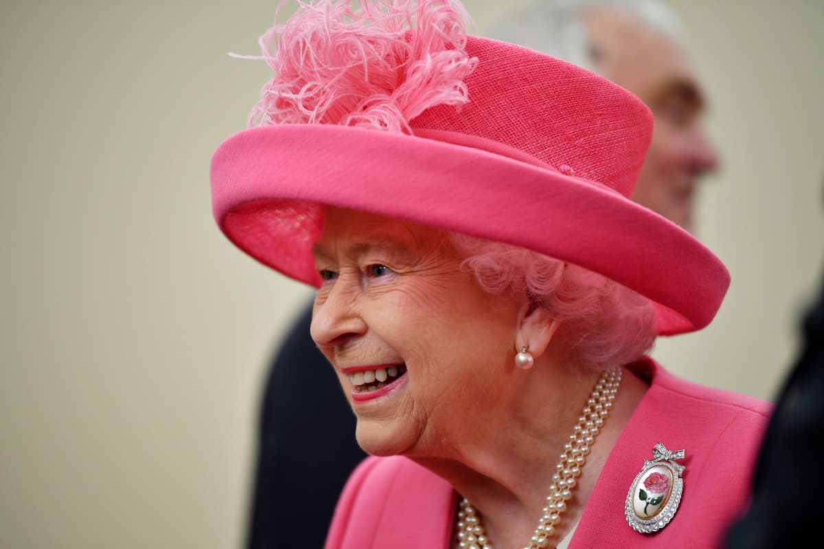 Queen Elizabeth Wears Gloves At Investiture Amid Coronavirus