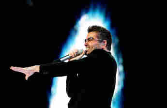 George Michael performs during a concert in Amsterdam, 26 June 2007.