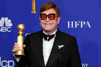 Elton John poses in the press room with the award for Best Original Song - Motion Picture during the 77th Annual Golden Globe Awards at The Beverly Hilton Hotel on January 05, 2020 in Beverly Hills, California