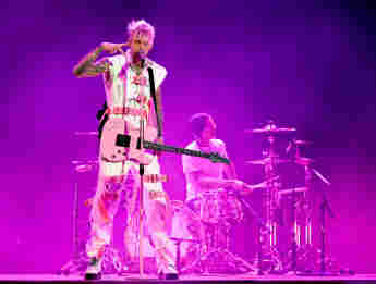 Machine Gun Kelly Claps Back At A Fan Over Guitar Comments!