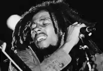 Bob Marley (1945 - 1981) performs on stage in the late 1970's