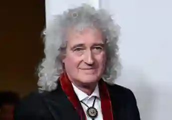 Brian May Battling "Horrendous" Case Of COVID-19 Queen guitarist coronavirus news latest update 2021 Instagram post wife