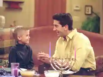 Cole Sprouse and David Schwimmer in the 'Friends' episode, "The One With the Holiday Armadillo"
