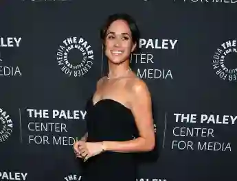 Duchess Meghan in a black dress