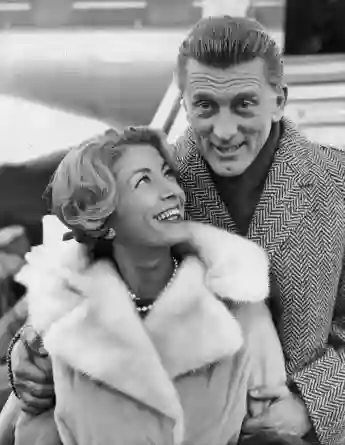 5th December 1960: Kirk Douglas and his wife Anne Budyens arriving in London for the premiere of his new film, 'Spartacus'.