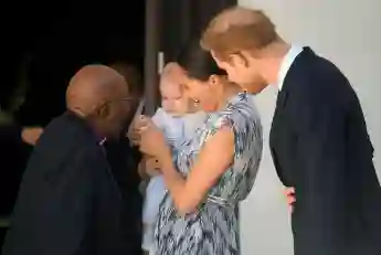 Prince Harry and Meghan holding their son Archie, meet Archbishop Desmond Tutu at the Desmond & Leah Tutu Legacy Foundation in Cape Town, South Africa, September 25, 2019.
