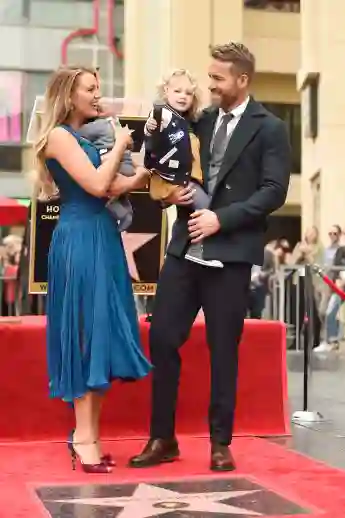 Blake Lively and Ryan Reynolds pose with their daughters as Ryan Reynolds is honored with star on the Hollywood Walk of Fame on December 15, 2016 in Hollywood, California.