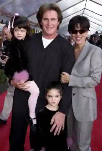 HOLLYWOOD, : Former US gold medal decathlete Bruce Jenner (C), his wife Kris (R) and children Kylie (L) and Kendall (BELOW) appear at the, 10 December 2000, premiere of Walt Disney's "The Emperor's New Groove" at the El Capitan Theater in Hollywood, CA. The film opens in the US on 15 December 2000 AFP Photo/Scott NELSON (Photo credit should read Scott Nelson/AFP via Getty Images)