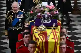 King Charles III behind the Queen's coffin