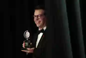 Sean Hayes, winner of the award for Best Performance by a Leading Actor in a Play for Good Night, Oscar, holds a Tony Aw