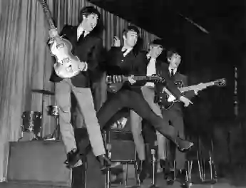 The Beatles rehearsing for the Royal Variety Performance Photo of The Beatles jumping during rehearsal for the Royal Var
