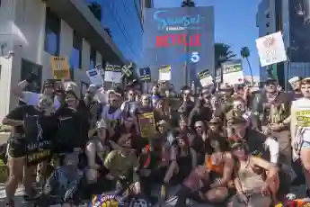 November 8, 2023, Los Angeles, California, United States: Striking SAG-AFTRA members walk with pickets outside Netflix s