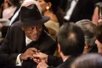 Actor Morgan Freeman greets another guest at the Kennedy Center Honors reception at the White House on December 2, 2012