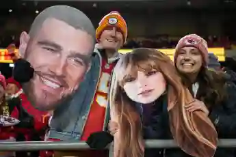 Syndication: USA TODAY Chiefs fans wave Taylor Swift and Travis Kelce cutouts at Arrowhead Stadium. , EDITORIAL USE ONLY