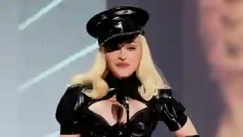 Madonna in a leather outfit on stage