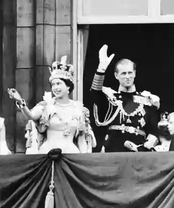 Queen Elizabeth II and Prince Philip wave to the crowd, June 2, 1953 after being crowned at Westminster Abbey in London.