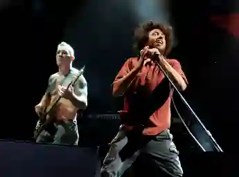 Musician Tim Commerford and singer Zack de la Rocha of Rage Against the Machine performs at L.A. Rising at the L.A. Memorial Coliseum on July 30, 2011 in Los Angeles, California