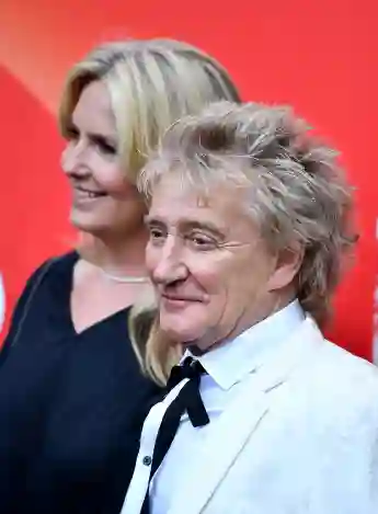 Rod Stewart and Penny Lancaster pose together at an event
