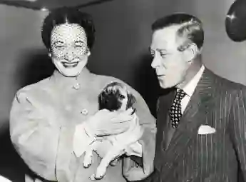 The Duke and Duchess of Windsor with their three-month-old pug terrier Disraeli in Italy, 1965.