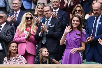 Princess Kate waves to the spectators at Wimbledon