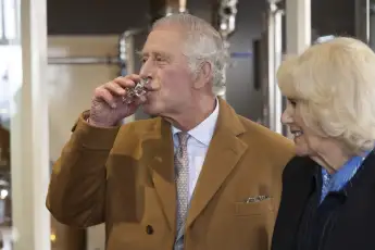 King Charles III samples gin during a visit to Yorkshire on April 06, 2023.
