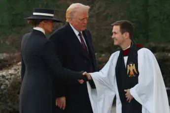Melania Trump and Donald Trump with Rev. Robert W. Fisher