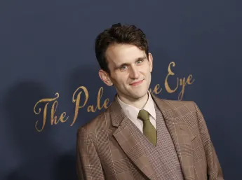 Harry Melling, who rose to fame as "Dudley Dursley" in "Harry Potter," on the red carpet in December 2022
