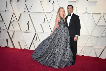 91st Academy Awards Arrivals - LA Kelly Ripa (L) and Mark Consuelos walking the red carpet as arriving to the 91st Acade