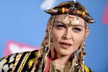 Madonna Postpones Tour After Suffering Serious Bacterial Infection File photo dated August 20, 2018 of Madonna poses bac