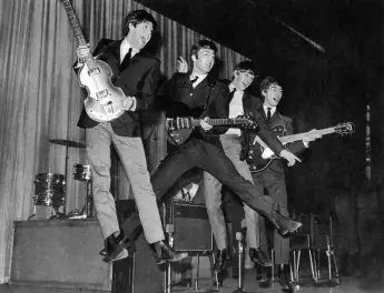 The Beatles rehearsing for the Royal Variety Performance Photo of The Beatles jumping during rehearsal for the Royal Var