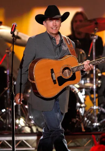 George Strait performing at the ACM Awards, 2004. ph: Ron Wolfson / Everett Collection (George Strait)RWFA004 UW333 PUBL